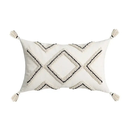 Cream-colored rectangular cushion cover with black decorbites geometric embroidery and tassels for living room decor