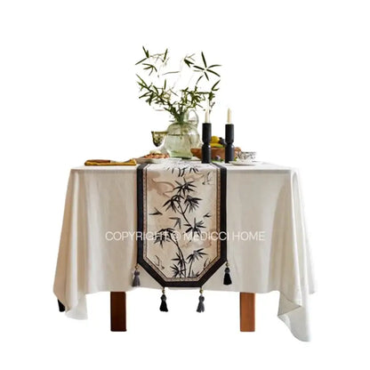 Beige table runner with black bamboo leaf swallow print embroidery and tassels for decorbites dining room decor