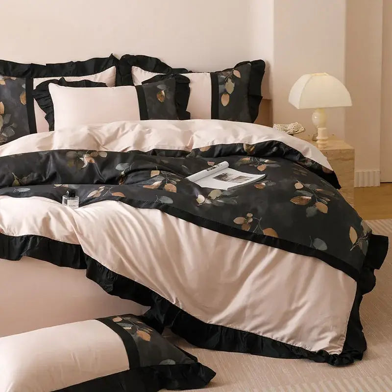 Black and cream satin bedding set with delicate leaf pattern and ruffled edges from decorbites ice rayon summer collection