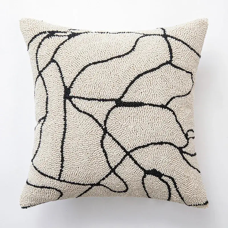 Cream-colored textured cushion cover with abstract black geometric line art for elegant decorbites decorbites geometric line design
