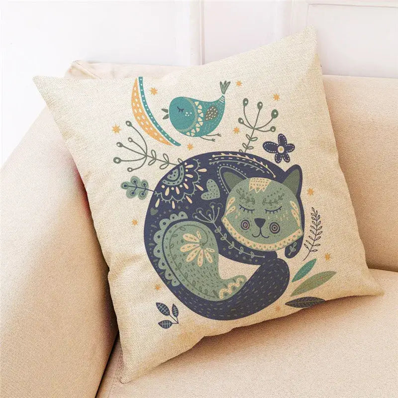 Beige cartoon cat linen throw pillow featuring a whimsical sleeping green cat with foliage and teal bird decorbites cartoon cat