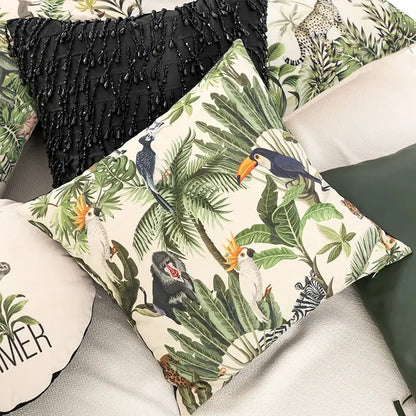 Beige velvet cushion cover featuring a vibrant decorbites jungle cartoon print with toucans monkeys and zebras