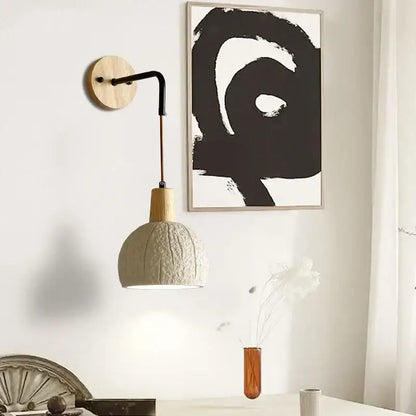 Beige cement shade wood wall sconce with textured off-white ceramic pendant lamp and black metal arm for bedroom decorbites decor