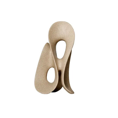 Beige ceramic coral hollow sculpture with smooth flowing curves and two oval cutouts for living room decorbites coral hollow decor