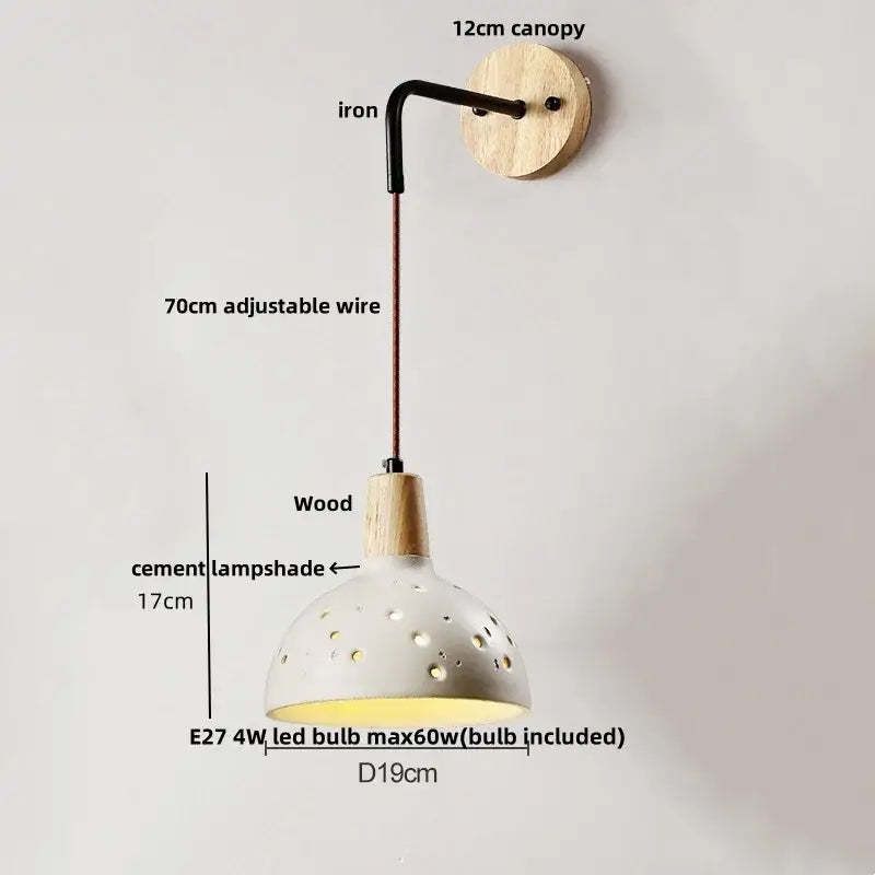 Beige ceramic wall sconce with pull chain switch featuring perforated shade wooden canopy and iron arm for bedroom use