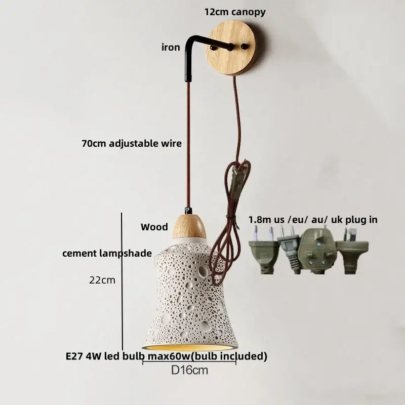 Beige ceramic wall sconce with white cement textured lampshade hanging from wooden canopy with pull chain switch