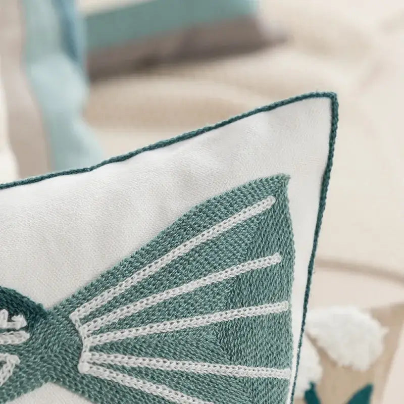 White cushion pillow cover with teal embroidered butterfly and contrasting stitching for decorbites daisy floral geometric decor