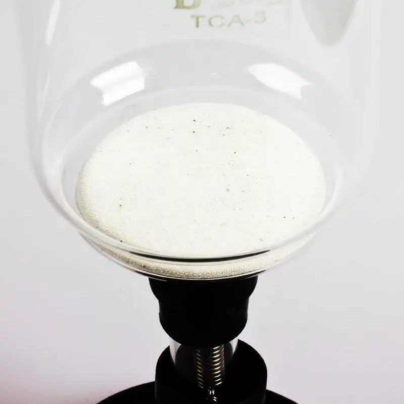Beige eco-friendly flannel cloth coffee filters 10pcs set with clear glass beaker containing white granular substance