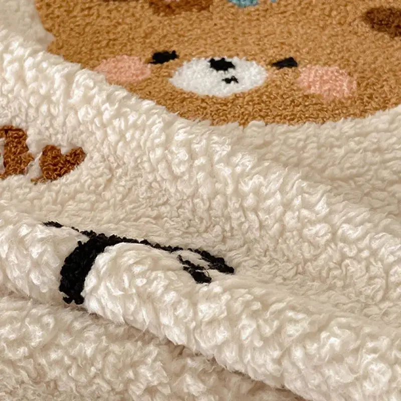 Beige embroidered teddy fleece blanket with cream plush soft texture and cozy teddy fleece bear face decorbites design