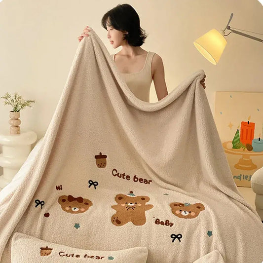 Beige embroidered teddy fleece blanket with cute bear designs and text in brown for cozy teddy fleece decorbites