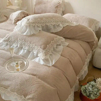 A delicate ivory lace-trimmed pillow sham with french lace ruffles rests on a plush beige bedding set decorbites velvet bedspread