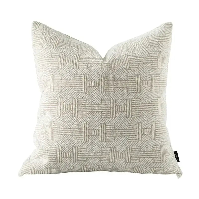 A beige geometric jacquard cushion cover with a subtle weave pattern in textured fabric for living room decor
