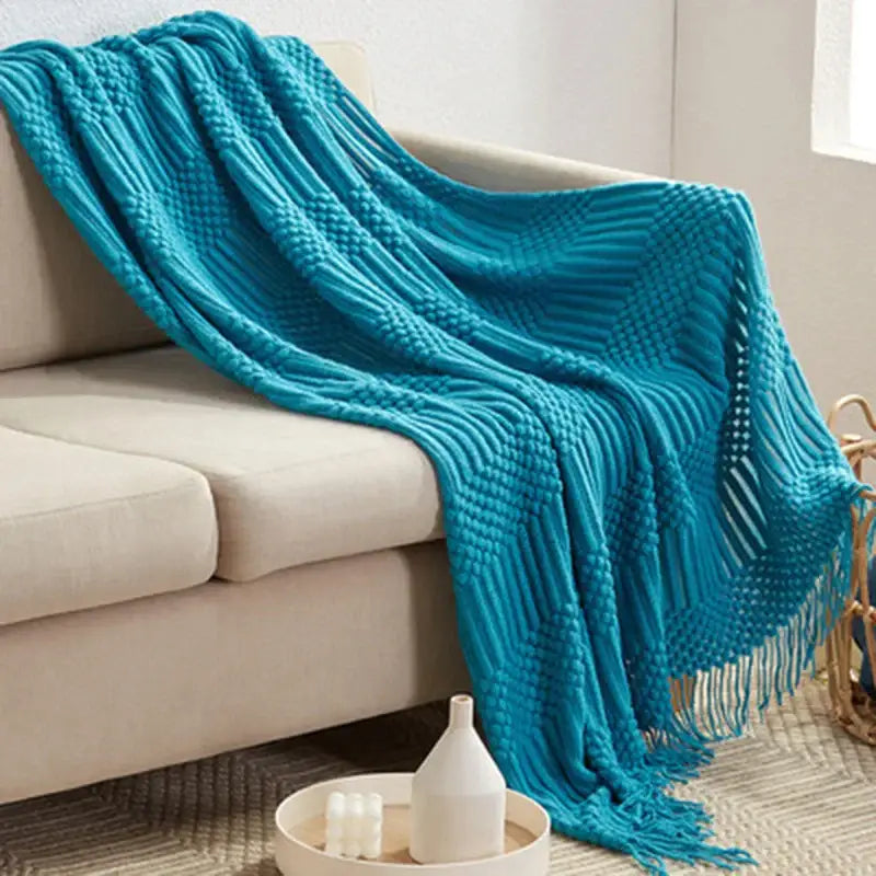 Vibrant turquoise decorbites 3d knitted tassel blanket with ribbed pattern and fringe detailing for bedroom decor