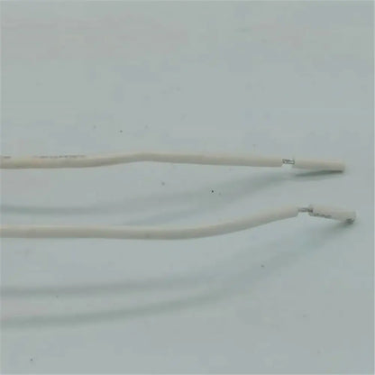 Two white insulated wires with metal connectors attached to beige gu10 ceramic socket holder with metal bracket
