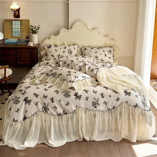 Cream-colored bedding set with beige lace ruffles and black floral butterfly print for elegant bedroom decorbites beige lace decor