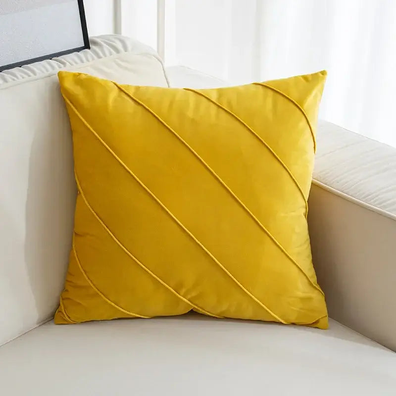 A vibrant mustard-yellow velvet throw pillow with diagonal hand pleat embroidered cushions for living room decor