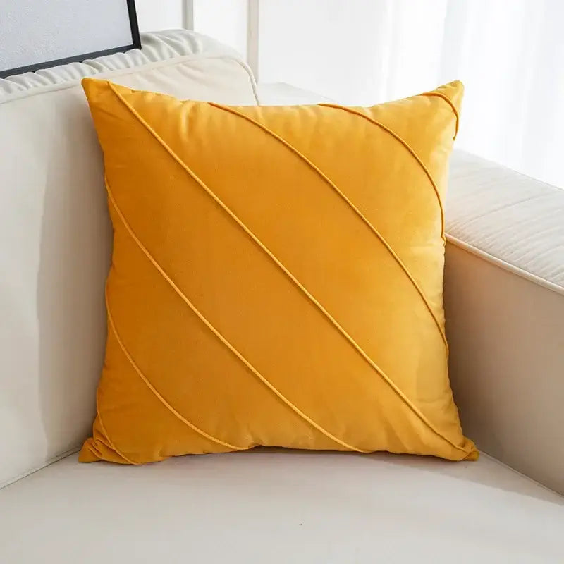 A plush mustard-yellow velvet throw pillow featuring hand pleat embroidered diagonal stitched pleats for living room decor