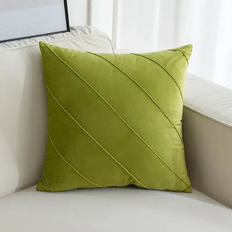 A square lime green velvet pillow with diagonal stitched lines featuring hand pleat embroidered design for living room use