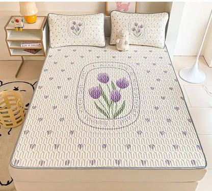Cream-colored quilted bed pad with embroidered purple tulips and a gray border for decorbites cartoon pattern latex mattress