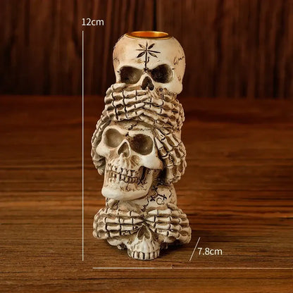 Beige resin bone skeleton candlestick holder with three skulls and skeletal hands for dining room decorbites bone skeleton decor