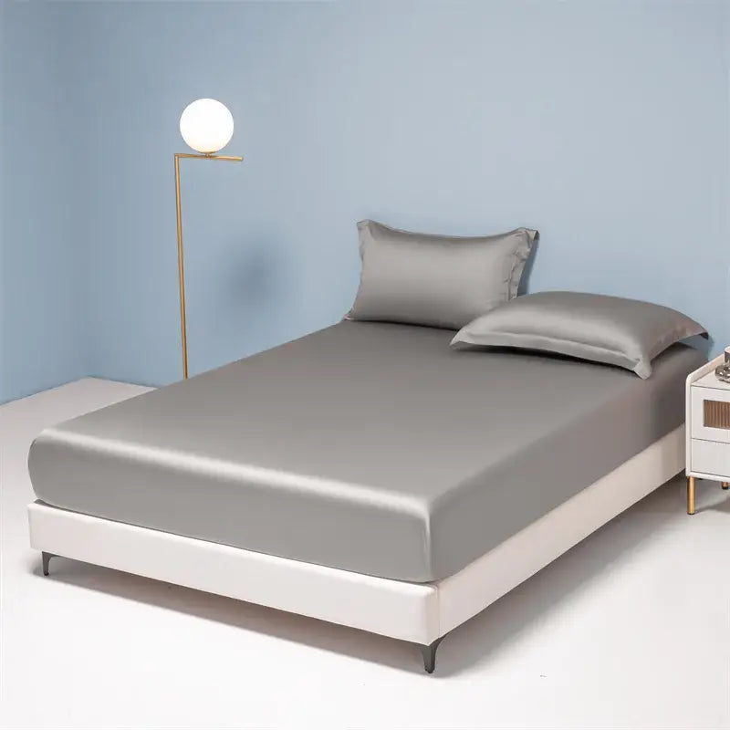 Silver satin fitted sheet with matching pillowcases featuring smooth glossy finish in decorbites 1000tc egyptian cotton set