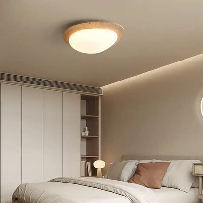 Beige speckled stone led ceiling light with warm diffused glow and natural wood-textured frame for bedroom decorbites led ceiling