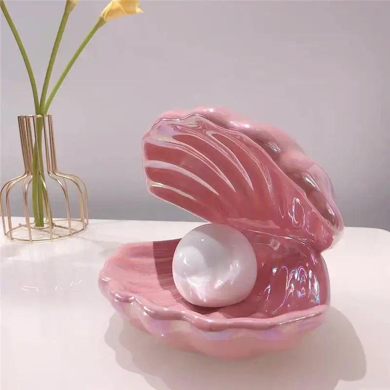 Beige and terracotta decorbites ceramic shell pearl night light features a glossy pink ceramic shell with a white pearl