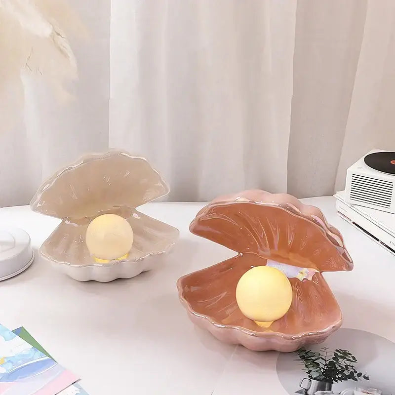 Beige and terracotta ceramic shell pearl night light lamps by decorbites featuring glowing yellow orbs for bedroom decor