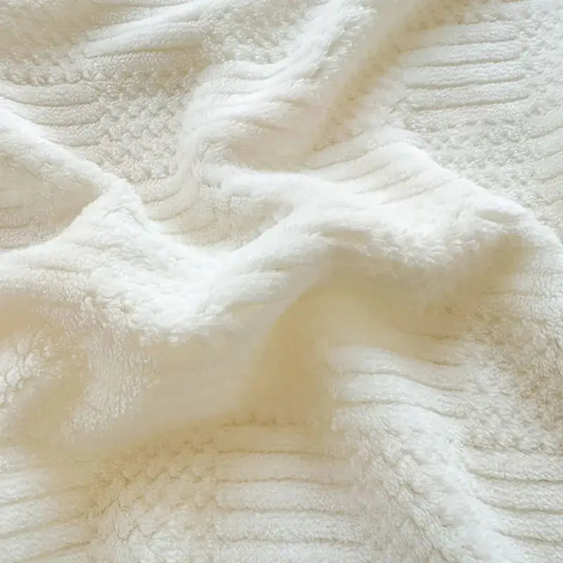 Beige textured cozy lamb wool blanket with ribbed cream-colored plush fabric for living room sherpa throw decorbites cozy lamb
