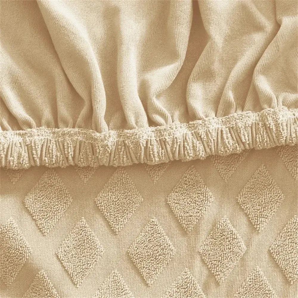 Beige textured jacquard elastic seat cover with diamond raised patterns and ruffled elastic hem for dining chair decorbites seat covers