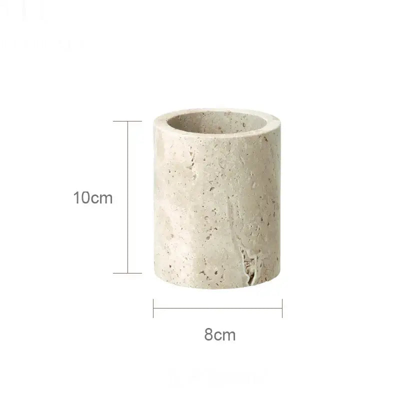 A beige travertine marble cylindrical planter with a textured speckled surface and slightly rough edges from decorbites beige travertine set
