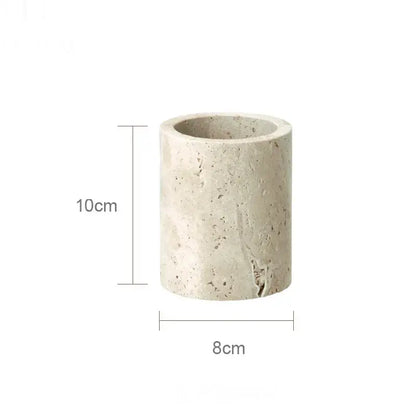 A beige travertine marble cylindrical planter with a textured speckled surface and slightly rough edges from decorbites beige travertine set