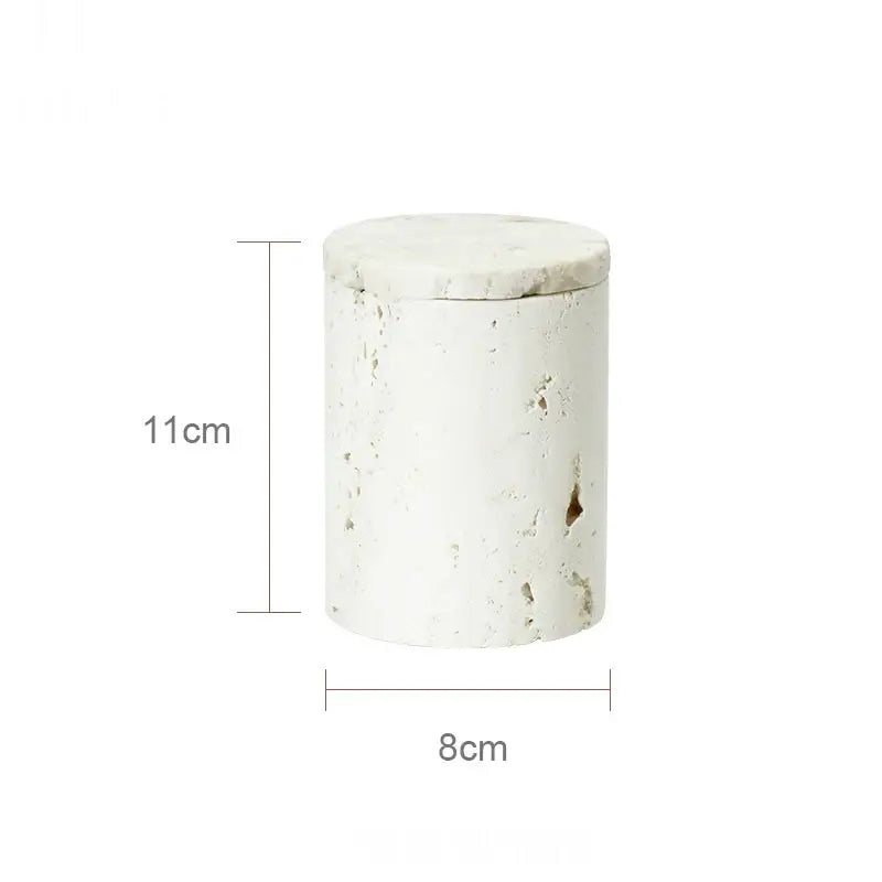 White textured cylindrical jar with lid featuring beige travertine marble stone-like finish from decorbites bathroom set