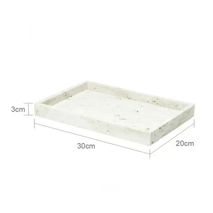 A rectangular white stone tray with speckled texture and raised edges in decorbites beige travertine marble bathroom set