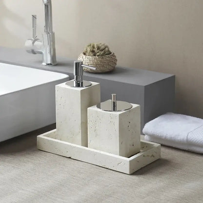 Beige travertine marble bathroom set with cream-colored stone and chrome pump dispensers by decorbites travertine marble