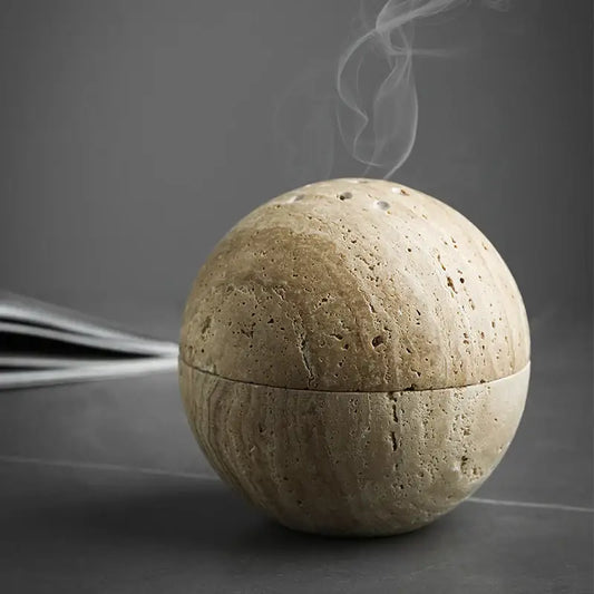Beige travertine marble sphere incense burner with textured porous surface and subtle seam for living room decorbites decor