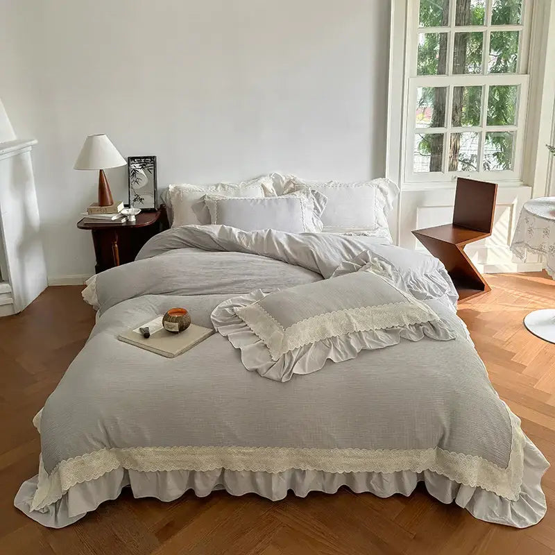 Beige and white lace ruffles bedding set featuring light gray ruffled duvet cover with delicate cream lace trim