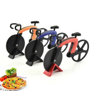 Three stainless steel bicycle pizza cutters in orange blue and red with bike wheel blades and black handles