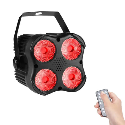 Black 4x8w mini rgbw led stage par light with four red bulbs and carrying handle shown with remote control for dj events