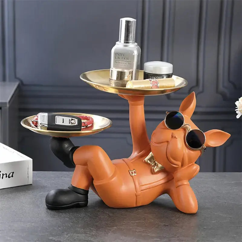 Orange pig figurine with sunglasses and bow tie holding gold trays in decorbites bulldog animal figurine style