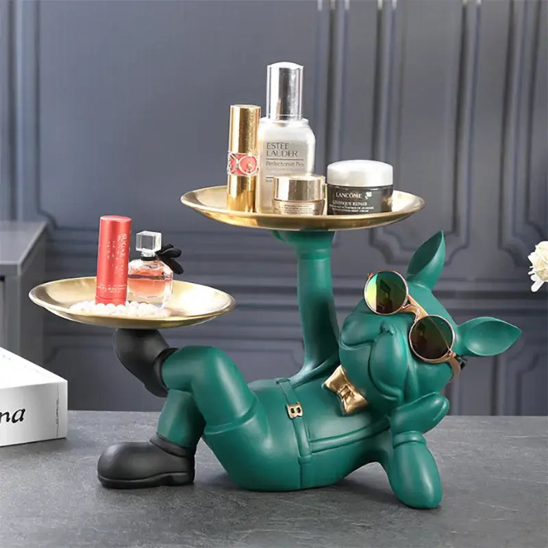 Teal resin decorbites bulldog animal figurine wearing sunglasses and holding two gold-trimmed trays as living room butler tray