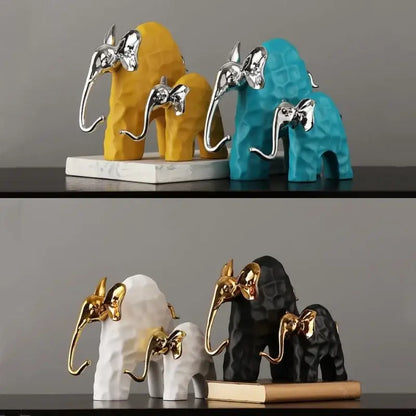 Set of three decorbites elephant mother-calf golden resin sculpture with black and gold geometric textured accents