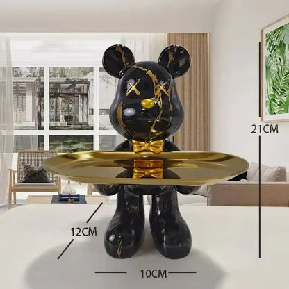 Black and gold graffiti bear figurine with glossy finish holding a shiny gold tray for living room decorbites decor