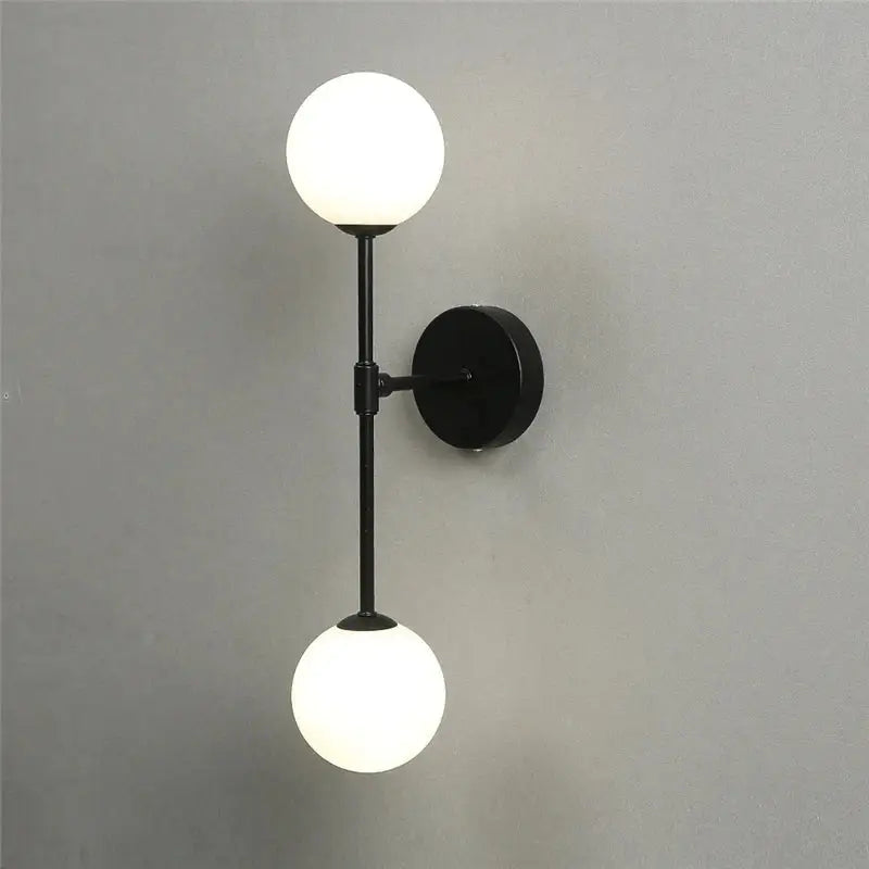 Black metal wall lamp with two frosted glass globes from decorbites golden glass led bedroom sconce collection