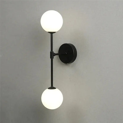 Black metal wall lamp with two frosted golden glass led globes for bedroom decorbites golden glass sconce