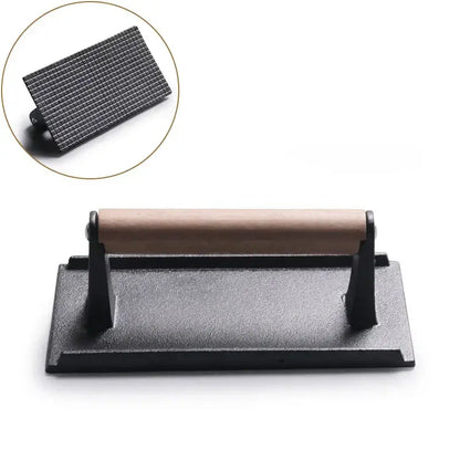 Black and light brown cast iron burger press kitchen meat tool with wooden handle and textured pressing surface decorbites cast iron