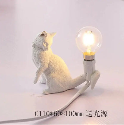 White ceramic cat resin table lamp with glowing bulb on back for bedroom decorbites cat resin decor
