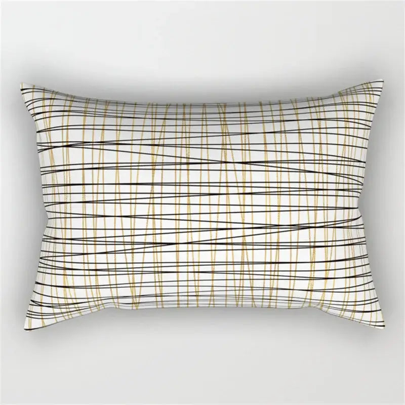 Rectangular pillow with a black and white geometric wave line design featuring intersecting black and gold lines