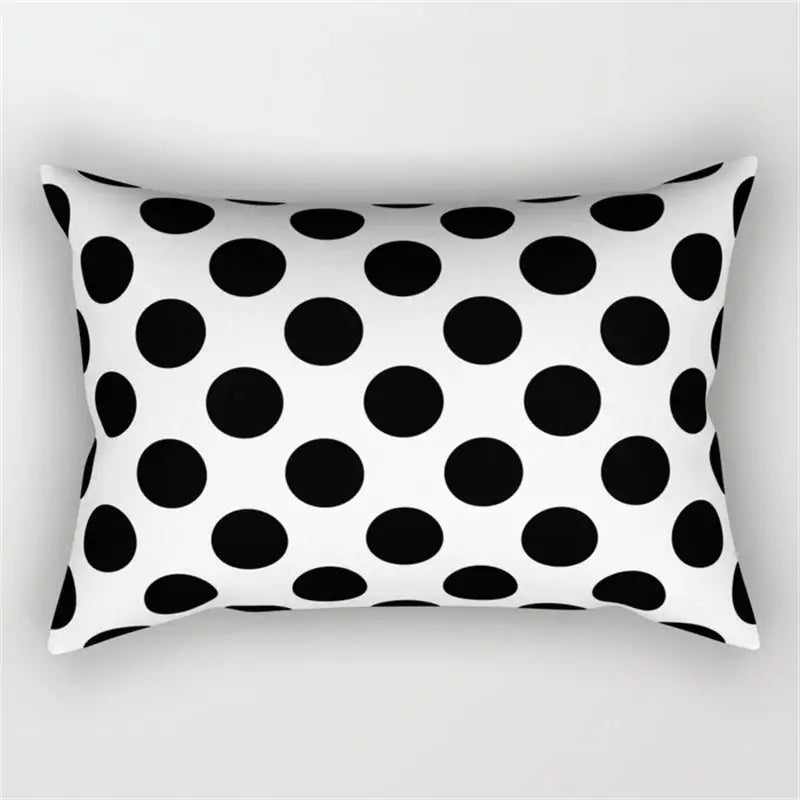Rectangular pillow with bold black and white polka dot pattern in a geometric wave line pillowcase set for bedroom decor