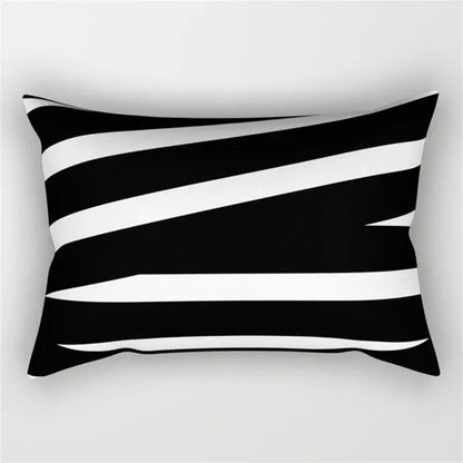 Rectangular pillow with bold black and white diagonal stripes featuring a geometric wave line design for bedroom decor